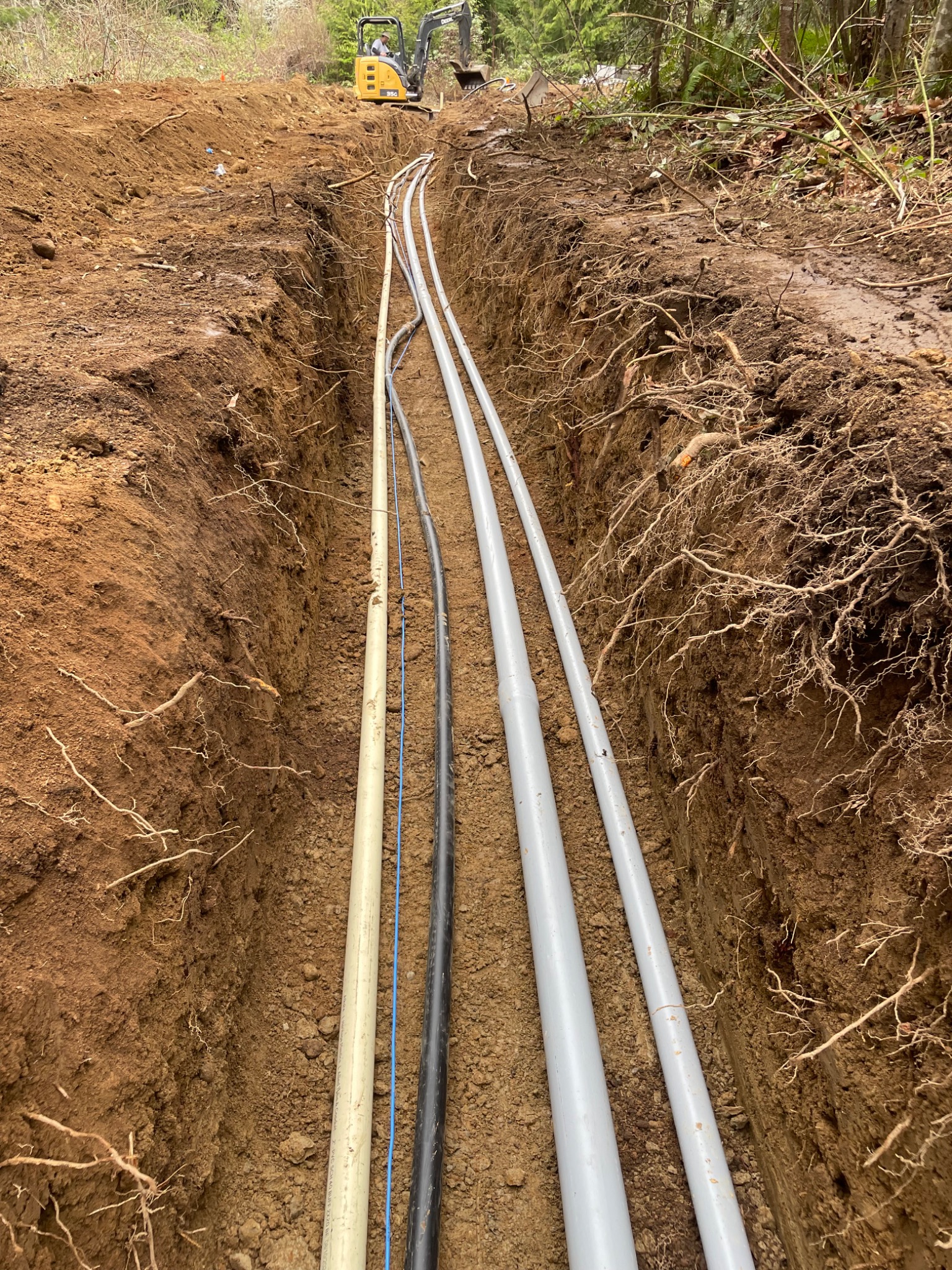 Utility lines installed in an excavated trench